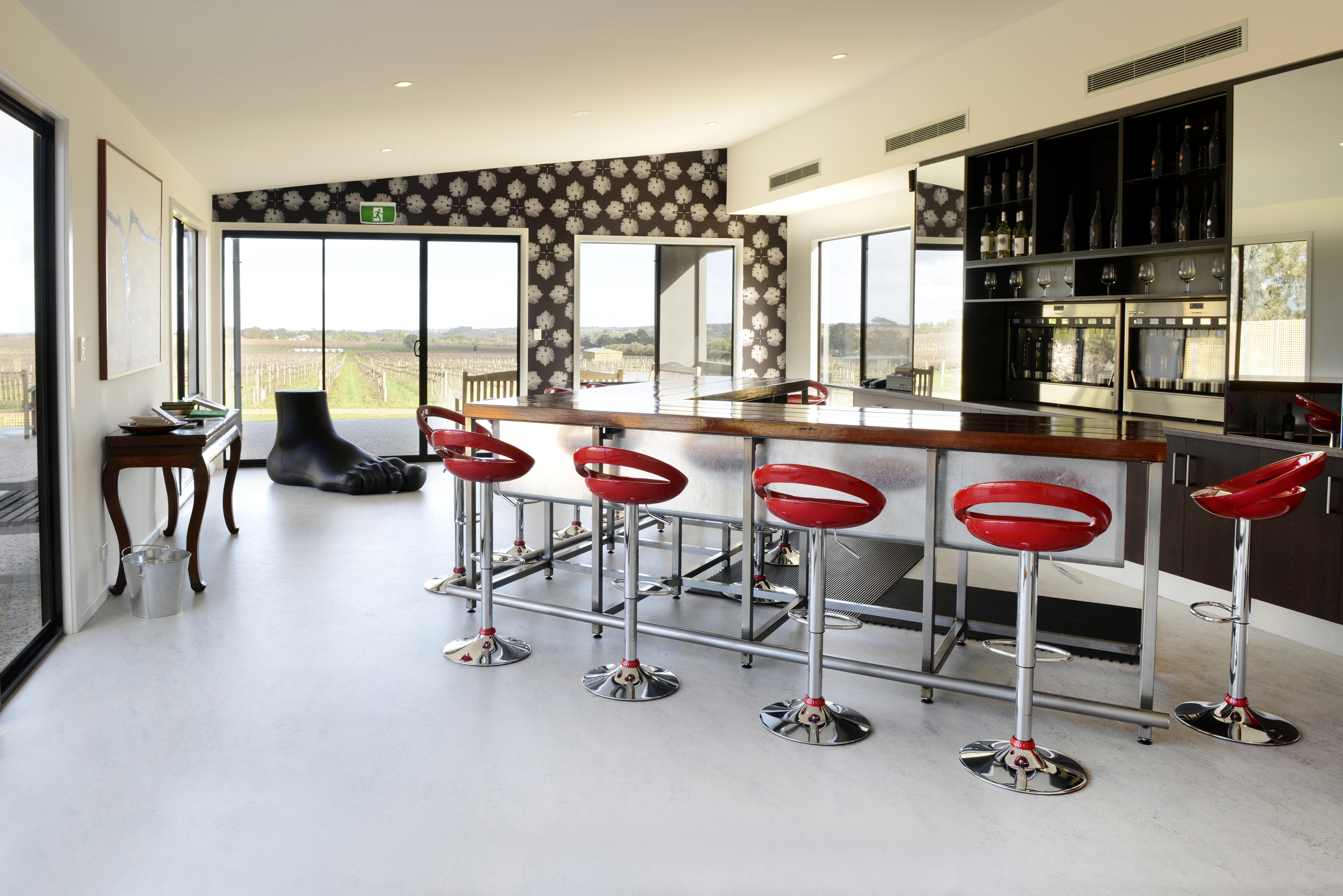 Bar room with huge windows overlooking vineyard 